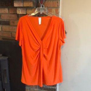 1x/1T orange short sleeved blouse.